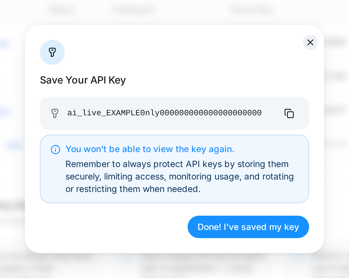 Save Your API Key dialog showing the new key once, with a copy button and a Done! I've saved my key button